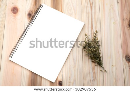 Notebook cover on textured wood background