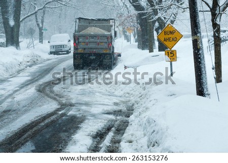 Stamford, CT, USA - March 5, 2015: Daylight street scene during a snow storm in Stamford Connecticut on March 15th, 2015