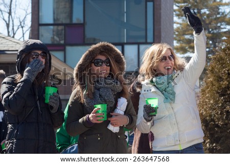 Greenwich, CT, USA - March 22, 2015: Spectators enjoying the  
