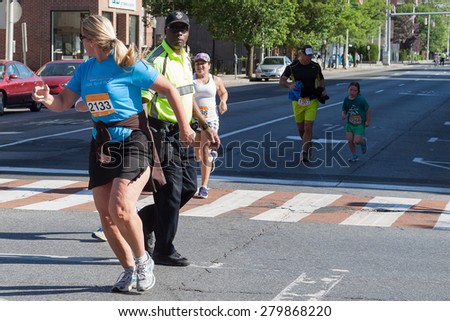 Stamford, CT, USA - June 1, 2014: The individuals are some of the many runners for the cancer awareness marathon in Stamford, CT, June 1, 2014