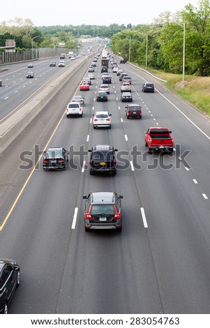 Stamford, CT, USA - May 29, 2015: Daytime traffic on the interstate highway on May 29, 2015 in Stamford Connecticut