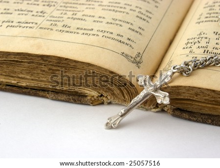Old bible and silver cross