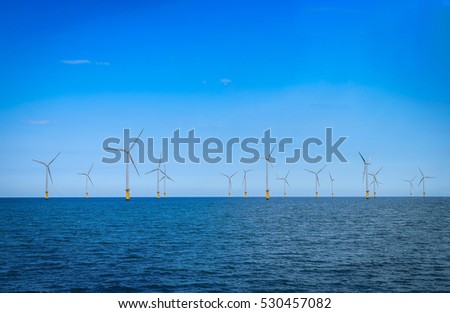 Offshore Wind Turbine in a Wind farm under construction off coast of England