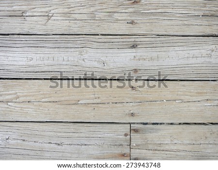 Weathered wood boards with nails.  Weathered gray color.