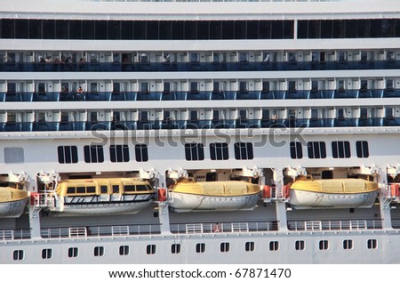view from a cruise line ship side with lifeboats and balcony stateroom