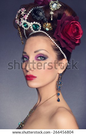 beautiful brunette young woman with accessories.fashionable lady.jewelery queen. Crown hair