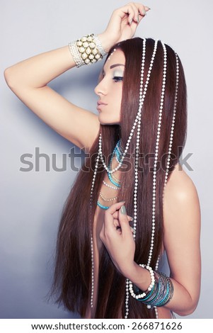 Fashion studio photo of beautiful sexy woman with jewelry.Young woman with long hair