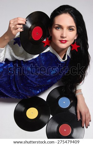 Young woman with vinyl disc.Retro Disco girl.pop Star
