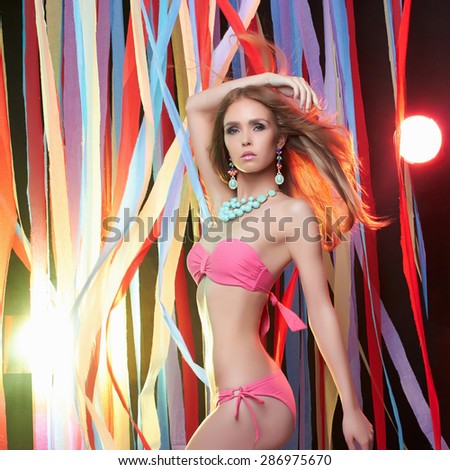 beauty dancing young woman in bikini.Beautiful show girl on a party.go-go