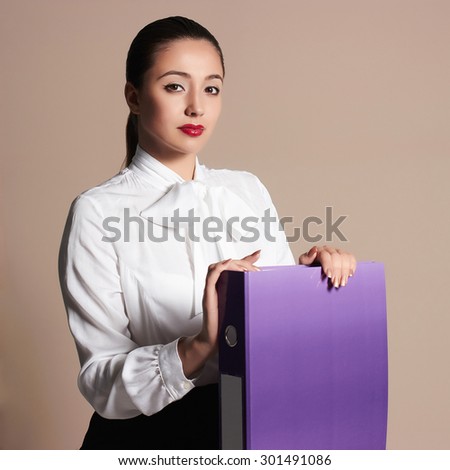 beauty business woman.beautiful girl in formal wear.accountant with a folder