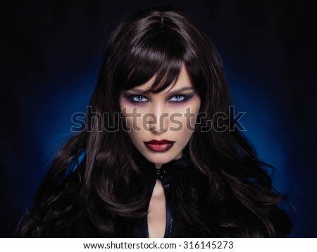 beautiful young vampire woman.black haired sexy halloween girl