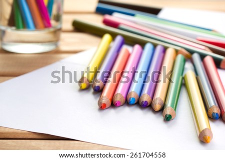 set of pencils on wooden background