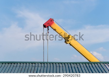 Jib of auto crane above the roof