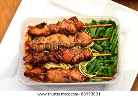 Traditional suriname food in take away box