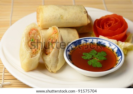 Isolated of vietnamese spring rolls with sweet chilli dip sauce.
