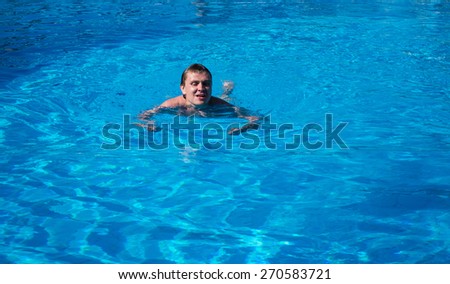 Photo of the man swim in the pool