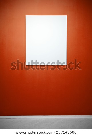 Blank picture poster in a red gallery wall