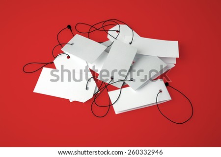 Blank price tags on red background