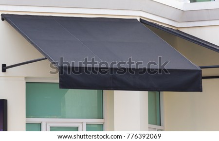 black awning and steel structure over window frame, outdoor house decoration