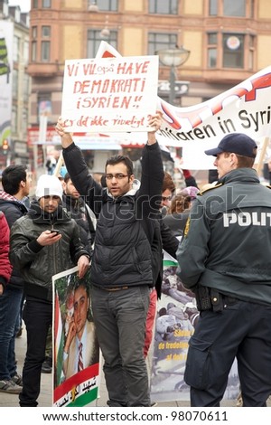 COPENHAGEN, DENMARK - MARCH 18: An unidentified young man calls for democracy in Syria on City Hall Square on March 18, 2012 in Copenhagen, Denmark