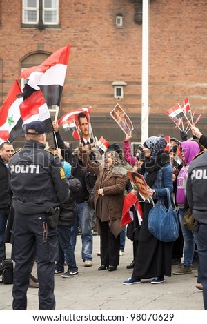 COPENHAGEN, DENMARK - MARCH 18: Happy women cheer at meeting for support Bashar al-Assad politic in Syria on City Hall Square on March 18, 2012 in Copenhagen, Denmark