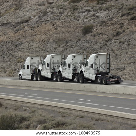 4 humped trucks towing