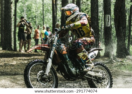 Kyshtym, Russia - June 21, 2015: A motocross driver competes during the race Urals Cup of Enduro \