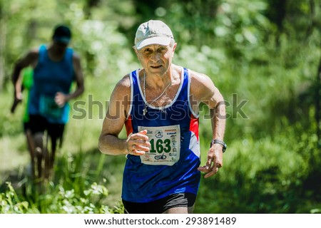 Miass, Russia - June 28, 2015: old man run during marathon \
