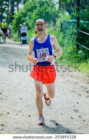 Miass, Russia - June 28, 2015: old man finishes a marathon \