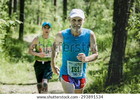 Miass, Russia - June 28, 2015: old man run during marathon \
