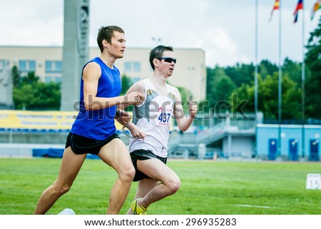 Chelyabinsk, Russia - July 05, 2015: blind men athletes run 800 meters during Championship of Russia on track and field athletics among the blind, Chelyabinsk, Russia - July 05, 2015