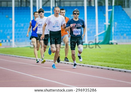 Chelyabinsk, Russia - July 05, 2015: blind men athletes run 800 meters during Championship of Russia on track and field athletics among the blind, Chelyabinsk, Russia - July 05, 2015