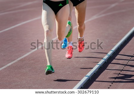 Chelyabinsk, Russia - July 24, 2015: girl athletes running distance during National competitions in memory of G. I. Nicewhen athletics, Chelyabinsk, Russia - July 24, 2015