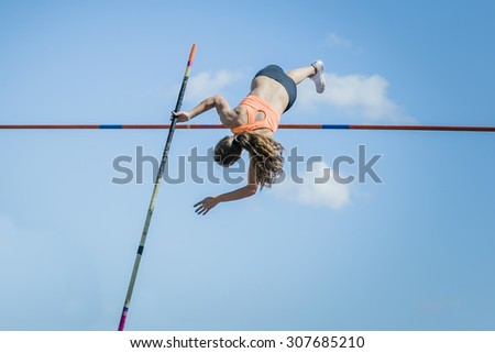 Chelyabinsk, Russia - July 24, 2015:  Girl athletes pole vault during National competitions in memory of G. I. Nicewhen athletics, Chelyabinsk, Russia - July 24, 2015
