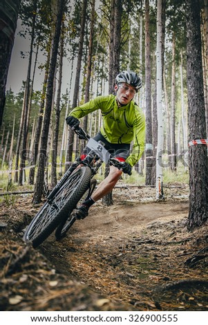 Sludorudnik, Russia - September 13, 2015: racer on mountain bike rides on a u-turn during Blagikh Racing Cup mountain bike