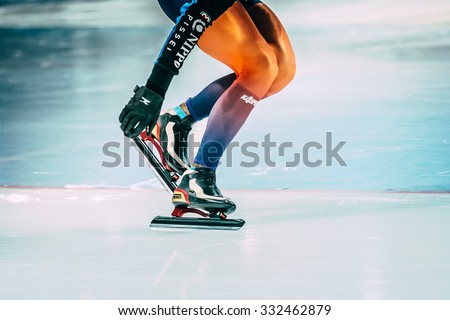Chelyabinsk, Russia - October 15, 2015: girl athlete speed skating shoveling snow with skate blades during Cup of Russia on speed skating