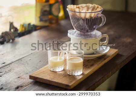 hot coffee and milk on wood board