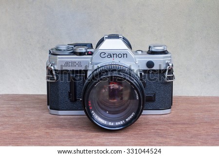 Sunday, 25 October 2015: in Chiang Mai Thailand, Canon AE-1 on wood table and vintage background.