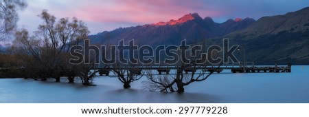 Red Light at Tooth Peaks, Glenorchy during sunrise. A panoramic view and long exposure on the lake wakatipu.