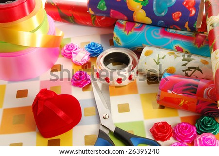 Gift packaging - scissors, ribbons, bow, paper