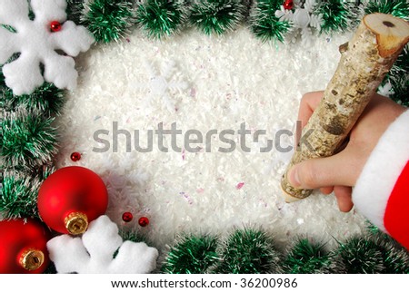 Christmas frame with snowflakes, balls and writing hand