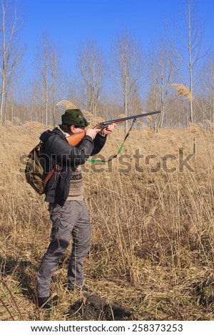 Hunter prepares to shoot wild ducks