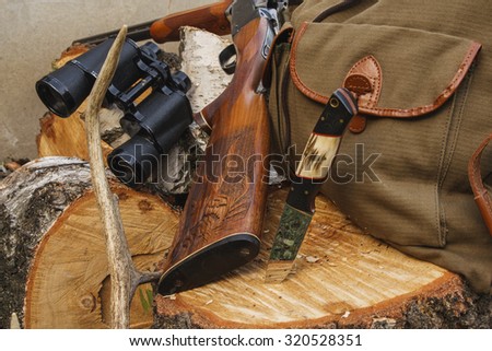 Rifle with hunting knife