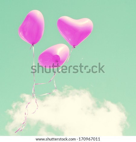 Retro purple heart balloons on mint sky