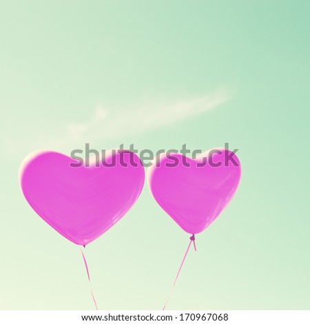 Retro purple heart balloons on mint sky