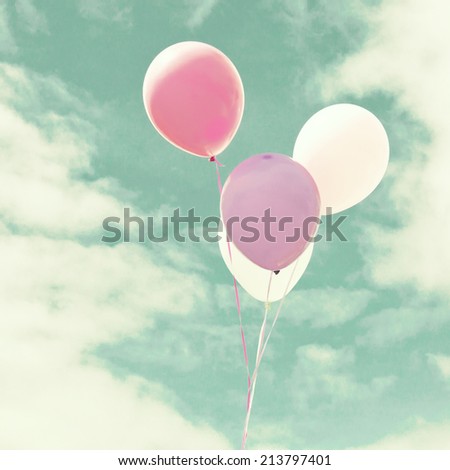 Colorful balloons over retro vintage background