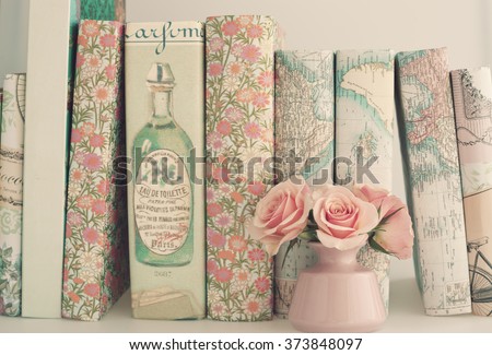 Pink peonies and books