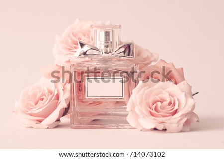 Vintage perfume bottle and roses