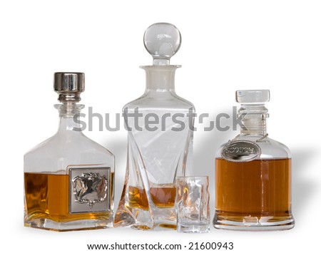 Masked image of clear glass decanters containing amber liquor, with small shot glass