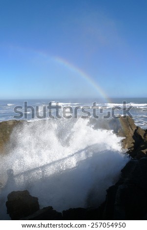 Rainbow above a wave